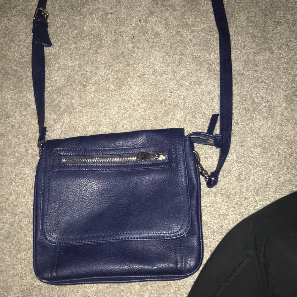 A navy blue cross body bag